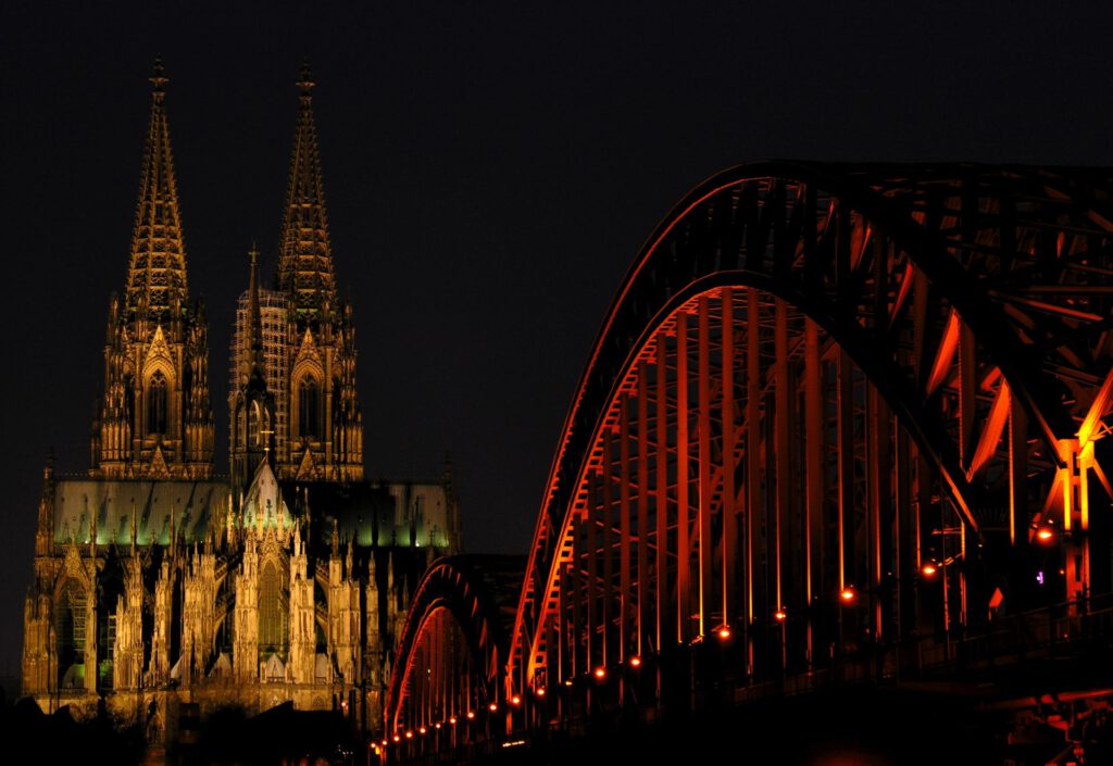Germany - Cologne - Cologne Cathedral and bridge at night